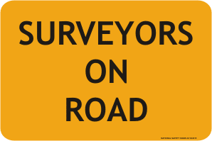 Surveyors on road sign